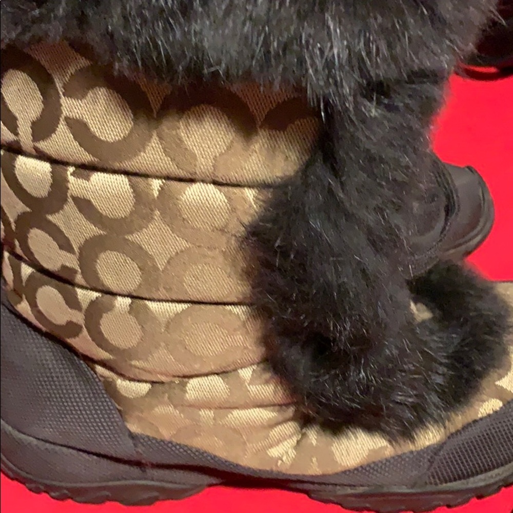 Coach women’s Tan and brown Jennie snow boots.